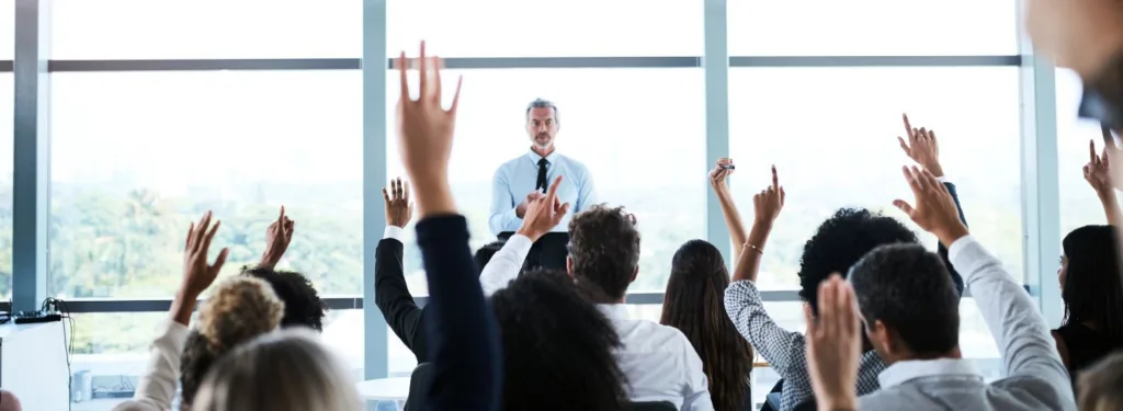 Do I Need Workers’ Compensation Insurance - hand raising